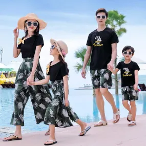 A Family Of Three Or Four Suits Beach